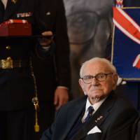 Britian Sir Nicholas Winton receives the Order of the White Lion at Prague Castle on Tuesday during celebration of Independance day. Winton, who saved hundreds of Jewish children in Prague from the Nazis before World War II, received the Czech Republic’s top honor from the president. Czechs honor Winton, 105, for rail evacuation of children facing Holocaust