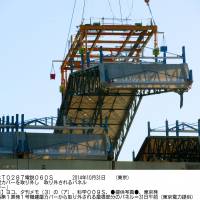 A crane removes a huge panel used to cover the reactor 1 building at the Fukushima No. 1 nuclear plant Friday, a first step toward removing spent fuel rods inside the reactor. | TOKYO ELECTRIC POWER CO./KYODO