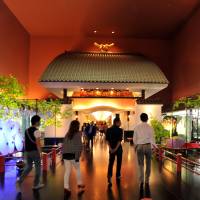 Visitors prepare to pass through the gate of Meguro Gajoen, a famed wedding hall that opened in 1931, on Sept. 17. | YOSHIAKI MIURA