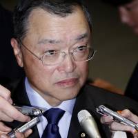 Newly appointed Economy, Trade and Industry Minister Yoichi Miyazawa speaks to reporters after visiting Prime Minister Shinzo Abe in Tokyo on Monday. | REUTERS