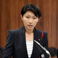 Trade minister Yuko Obuchi answers questions about the use of her political funds in the Diet on Thursday. | AFP-JIJI