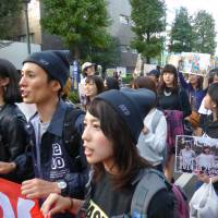 Students protesting against the state secrets law take part in a rally in Shibuya Ward, Tokyo, on Saturday. | SHUSUKE MURAI