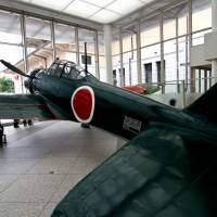 Ground zero: A Mitsubishi A6M Zero graces the entrance to the Yushukan War Museum at Yasukuni Shrine in Tokyo. While one reader says \"There is absolutely no integrity to be found anywhere in the Yushukan,\" another argues that \"the strength of the museum is the in-depth background it provides for the events of the 1930s and \'40s.\"  | RYUZO KUDO