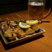 Skewered: Negima, one of many Cochin chicken dishes at Kinboshi. | ADAM MILLER