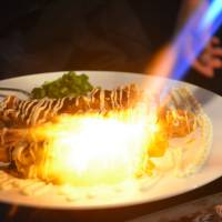 Hot meal: One of many prawn dishes at Osaka restaurant Mantenya, this time finished at the table with a blow-torch. | J.J. O\'DONOGHUE