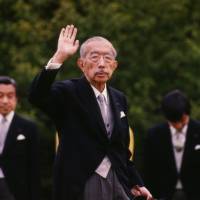 Loyal supporters: Emperor Hirohito waves during a party at the Akasaka Imperial Gardens in Tokyo in May 1988. Selective history: Hirohito's chronicles