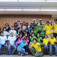 Hands on deck: Danny Gong (front) and DeafJapan supporters meet members of the deaf community in tsunami-hit Ishinomaki, Miyagi Prefecture, in 2012. | DEAFJAPAN