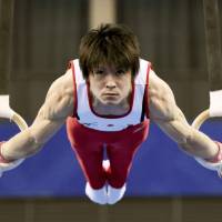 Second to none: Kohei Uchimura competes on the rings during the men’s all-around final at the 2014 Artistic Gymnastics World Championships on Thursday in Nanning, China. 'King Kohei' Uchimura captures fifth straight all-around world title