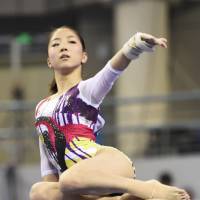 Keeping balance: Asuka Teramoto competes at the Artistic Gymnastics World Championships on Wednesday in Nanning, China. Japan took sixth in the women\'s team competition. | KYODO
