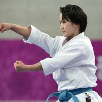 En route to gold: Kiyo Shimizu performs against Vietnam\'s Nguyen Hoang Ngan in the karate kata women\'s individual finals on Thursday at the Asian Games in Incheon, South Korea. | AFP-JIJI