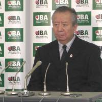 Still unresolved: Japan Basketball Association acting president Mitsuru Maruo (left) and Yoshiki Hoshi, the JBA secretary general, attend a news conference on Wednesday in Tokyo. The JBA has not finalized a plan for a merger between the NBL and the bj-league despite a FIBA-issued deadline of Oct. 31. | KAZ NAGATSUKA