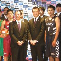 Changing leadership: NBL president Mitsuru Maruo (left) and chief operating officer Takashi Yamaya are seen at a news conference before the season tipped off earlier this month. Both men are leaving their current leadership positions at the NBL. | KAZ NAGATSUKA