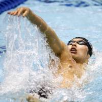 New standard: Kosuke Hagino competes in the men\'s 200-meter individual medley at a short-course World Cup on Wednesday at Tokyo Tatsumi International Swimming Center. Hagino broke his own national record in the event with a time of 1 minute, 51.27 seconds.  | KYODO