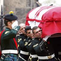 Soldiers carry the casket of Cpl. Nathan Cirillo from a church following his funeral Tuesday in Hamilton, Ontario. He was one of two soldiers killed in a pair of attacks that police said were carried out independently by converts to Islam at a time when Canada is stepping up its involvement in airstrikes against Islamic State militants in the Middle East. | REUTERS