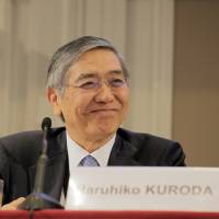 Bank of Japan Gov. Haruhiko Kuroda attends the International Symposium of the Bank of France policy conference in Paris on Friday. | BLOOMBERG