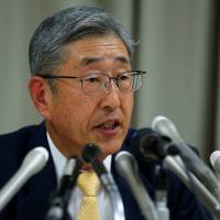 Takahiro Mitani, president of the Government Pension Investment Fund, appears in Tokyo last Friday to announce a new investment strategy focusing on stocks. | BLOOMBERG