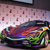 Seven-Eleven Japan Co. unveils its &#165;16 million car based on the \"Neon Genesis Evangelion\" anime at a Tokyo hotel Tuesday. | KAZUAKI NAGATA