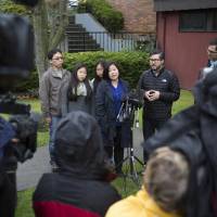 Terri Chung (center), the sister of Kenneth Bae, answers questions from the media after attending Sunday service at Quest Church in Interbay, Sunday. Kenneth Bae of Lynnwood, Washington, who was a prisoner in North Korea for two years, arrived at Joint Base Lewis-McChord Saturday night after being released with fellow U.S. citizen Matthew Todd Miller. His first meal at home was pizza from Papa John\'s, said his sister. | AP
