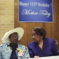 Jeralean Talley sits at the head table with her friend, Marian Allen, during a celebration of her 115th birthday at the New Jerusalem Missionary Baptist Church in Inkster, Michigan, on May 25. Scientists studying these “supercentenarians” said on Wednesday they sequenced the genomes of 17 people aged 110 to 116 to try to determine whether they possess genetic traits that may account for their membership in this exclusive club that worldwide includes only about 75 individuals, nearly all women. Scientists scour the genomes of people who live past 110