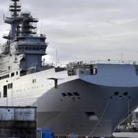 The Mistral-class assault warship Sevastopol, the second of two mammoth Mistral helicopter carriers built for Russia, is docked on Wednesday in the western French port of Saint-Nazaire after being taken from its dry dock on Nov. 20. | AFP-JIJI