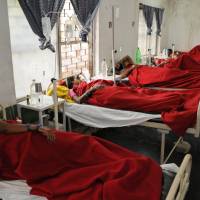Indian women who underwent sterilization surgeries receive treatment Wednesday at the District Hospital in the city of Bilaspur, in the central Indian state of Chhattisgarh. At least a dozen died and many others fell ill following similar surgery last week. | AP