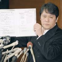 Mamoru Samuragochi, a composer once touted as a modern-day Beethoven but now accused of faking his deafness, holds a news conference in March in Tokyo. | KYODO