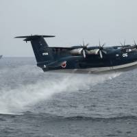 A Maritime Self-Defense Force seaplane takes off during a naval fleet review at Sagami Bay, near Yokosuka, in this October 2012 file photo. | REUTERS