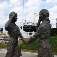 The Girl Scout Friendship Statue, erected in 1962, stands in Yamashita Park, Yokohama, to celebrate the relationship between girl scouts in the United States and Japan. | SHUSUKE MURAI