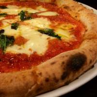 The Margherita at La Piccola Tavola and the title pizza at Massimotavio. | ALEX DUTSON