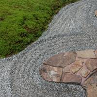 Round the garden: Curved paving stones are a hallmark of Mirei Shigemori’s work. The mortar and cement sealing is mixed with bengara, a red pigment. | STEPHEN MANSFIELD