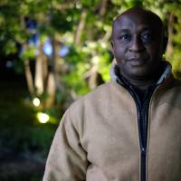 Duru Gerald raises three children — two from a previous marriage to a Japanese citizen — with his current wife, a Nigerian. “I have a wonderful family,” he says. “They have given me love, wisdom and peace through the grace of God.” This photo was taken while Duru’s vehicle was being subjected to a “random” search by the Tokyo police. Duru, a garment wholesaler, says that in a previous incident, he was detained under similar circumstances for five hours. | DREUX RICHARD