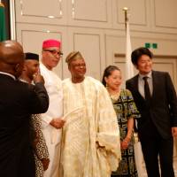 Kennedy Fintan Nnaji (center), president of the Nigerian Union, celebrates Nigeria’s independence at an embassy event. Nnaji, previously Imo State Union chairman, was inaugurated in May. Despite enjoying a reputation as a charismatic and politically shrewd leader, Nnaji was caught by surprise when the end of his tenure in the Imo State Union became mired in a contentious debate about whether the its next project would occur in Japan or Nigeria.  | DREUX RICHARD