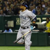 Pain during the game: Robinson Cano of the Seattle Mariners reacts after getting hit by a pitch from Japan\'s Yuki Nishi in the seventh inning of Game 3 of the MLB-Japan All-Star Series on Saturday at Tokyo Dome. | AP