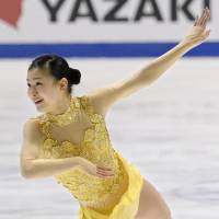 Chasing the leader: Kanako Murakami is less than four points behind Gracie Gold, who sits in first place, after Friday\'s short program.  | KYODO