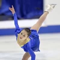 In the spotlight: Satoko Miyahara skates during the women\'s short program on Friday at the NHK Trophy.  | KYODO