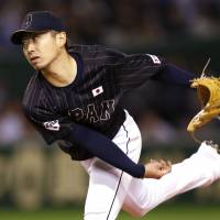 Not his best: Chihiro Kaneko pitches against the MLB All-Stars on Friday at Tokyo Dome. He allowed three runs in five innings. | REUTERS