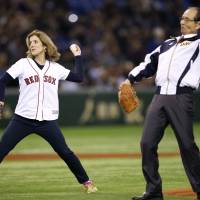 Before play begins: U.S. Ambassador to Japan Caroline Kennedy and baseball legend Sadaharu Oh throw out the ceremonial first pitches before Friday\'s game at Tokyo Dome. | REUTERS