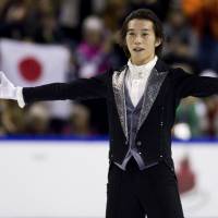 Takahito Mura gestures to the crowd after his free skate at Skate Canada on Saturday in Kelowna, British Columbia. Mura landed two quadruple jumps to capture the title after being in second place following Friday\'s short program. | REUTERS