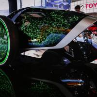 Toyota Motor Corp.\'s Future Mobility concept vehicle is unveiled at the Los Angeles Auto Show on Nov. 20. Other models unveiled included an upgraded compact sedan from Honda Motor Co. that is set for release next year. | BLOOMBERG