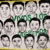 A banner with portraits of 43 Mexican students missing since their abduction by corrupt police in September, and a slogan reading \"We want them (back) alive,\" hangs outside their Ayotzinapa Teacher Training College in Tixtla, in the state of Guerrero, on Monday. Mexico\'s government said Friday it appeared likely the students had been killed and incinerated by gang hit men collaborating with the police, but it stopped short of confirming their deaths, citing a lack of definitive evidence. | REUTERS