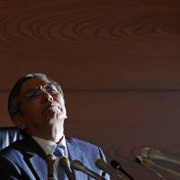 Bank of Japan Gov. Haruhiko Kuroda holds a news conference in Tokyo on Nov. 19. | REUTERS