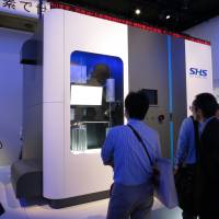 Honda Motor Co. displays a compact hydrogen station at CEATEC, Japan\'s biggest electronics and IT trade show, at the Makuhari Messe convention center in Chiba in October. | KAZUAKI NAGATA
