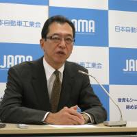 Fumihiko Ike, chairman of the Japan Automobile Manufacturers Associations, speaks to reporters Monday at the industry body\'s office in Tokyo. | KAZUAKI NAGATA