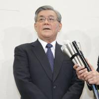 Kansai Electric Power Co. President Makoto Yagi answers questions from reporters Wednesday after asking the government to approve rate hikes for households. | KYODO