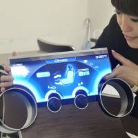 Sharp Corp.\'s bendable liquid crystal display allows for a wide variety of applications. | KYODO