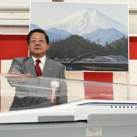 Koei Tsuge, president of Central Japan Railway Co., poses Wednesday as construction begins on a maglev station at JR Nagoya Station. Work began simultaneously on a maglev terminus at Tokyo\'s Shinagawa Station. | KYODO