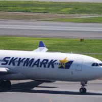 A Skymark Airlines Inc. aircraft taxies at Haneda airport in Tokyo in August. | BLOOMBERG
