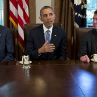 President Barack Obama speaks to reporters on Sept. 30, 2013, as then-Deputy Defense Secretary Ashton Carter (right) listens and Secretary of State John Kerry looks on in the Cabinet Room of the White House. Carter has emerged as Obama’s top candidate to become the next defense secretary, according to administration officials, putting him in line to take over a sprawling department that has had an uneasy relationship with the White House. Obama expected to nominate Ashton Carter to head Pentagon