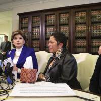 Facing reporters Wednesday in Los Angeles are (from left) Helen Hayes, celebrity attorney Gloria Allred, Chelan (first name given only) and Beth Ferrier. Hayes, Chelan and Ferrier alleged at the news conference that they were sexually assaulted by Bill Cosby in the past.  Three women on Wednesday came together to speak publicly about their allegations that Cosby sexually abused and groped them decades ago, a day after Cosby was sued by a woman who said he molested her when she was a teenager in 1974. The women, one who says she was 17 at the time of her encounter with Cosby, each sobbed while reading statements at a news conference organized by Allred. | REUTERS