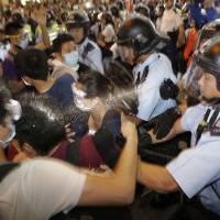 Riot police use pepper spray on protesters during a confrontation in Mongkok, on Hong Kong\'s Kowloon Peninsula, in October. | REUTERS